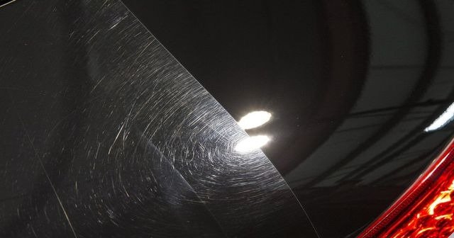 Before and after of car paint correction on a black car, showing the removal of swirl marks and scratches